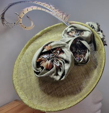 Photo of Hat1 Green saucer with feather